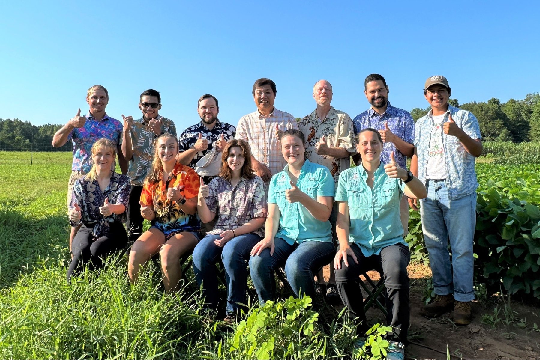 2023 Soybean group, posing with thumbs up.